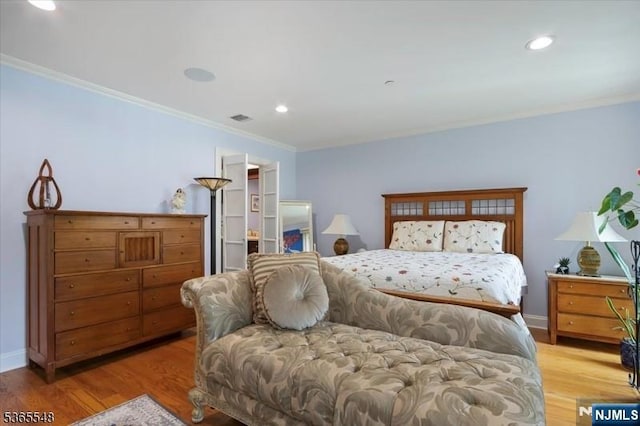 4 Lowell Ct Unit 704, Teaneck, NJ 07666 - bedroom with ornamental molding, light wood-style flooring, recessed lighting, and a spacious closet