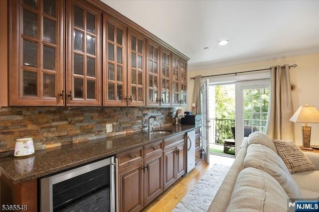 4 Lowell Ct Unit 704, Teaneck, NJ 07666 - bar with wine cooler, light wood finished floors, ornamental molding, tasteful backsplash, and recessed lighting