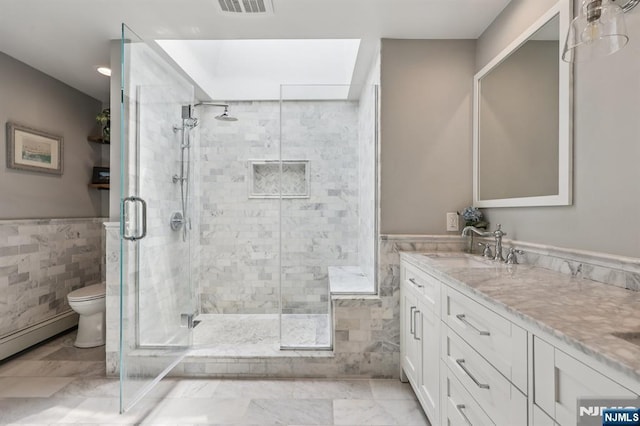 490 Ackerman Ave, Ho-Ho-Kus, NJ 07423 - full bathroom featuring tile walls, a shower stall, vanity, and wainscoting