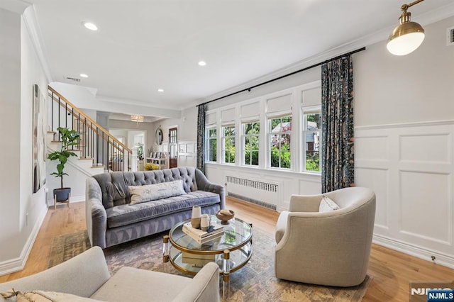 490 Ackerman Ave, Ho-Ho-Kus, NJ 07423 - living room featuring radiator, crown molding, stairs, a decorative wall, and recessed lighting