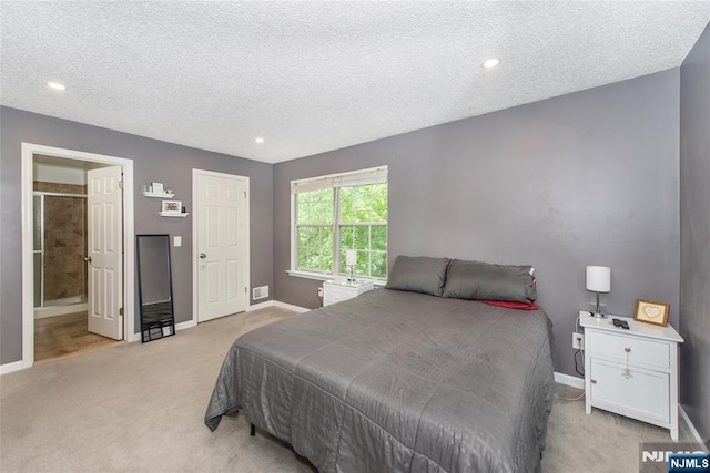 462 Poets Way, Mahwah, NJ 07430 - bedroom featuring light colored carpet, a textured ceiling, recessed lighting, and connected bathroom