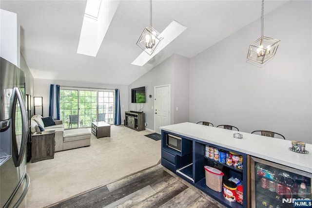 462 Poets Way, Mahwah, NJ 07430 - kitchen featuring vaulted ceiling, appliances with stainless steel finishes, a skylight, wine cooler, and open floor plan