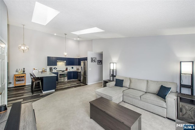 462 Poets Way, Mahwah, NJ 07430 - living area with a skylight, a textured ceiling, high vaulted ceiling, and carpet floors