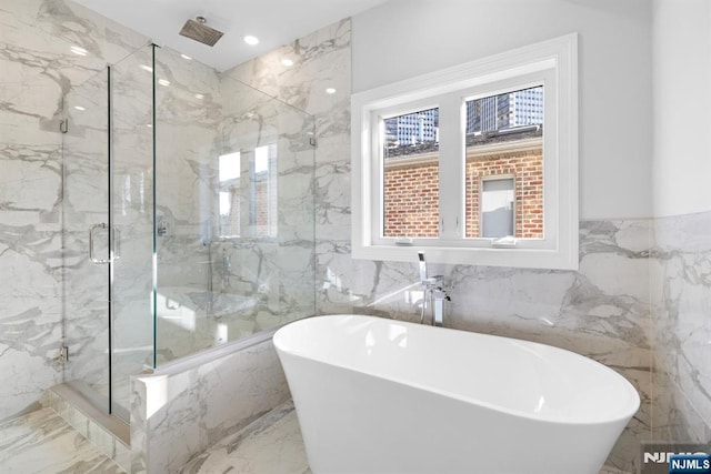 227 Wayne Ave Unit A, Cliffside Park, NJ 07010 - full bath featuring tile walls, a marble finish shower, a freestanding tub, marble tiled floors, and a wainscoted wall