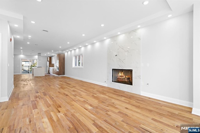 227 Wayne Ave Unit A, Cliffside Park, NJ 07010 - unfurnished living room featuring recessed lighting, light wood-style floors, and a high end fireplace