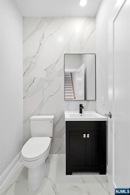 227 Wayne Ave Unit A, Cliffside Park, NJ 07010 - half bathroom featuring vanity and marble finish floors