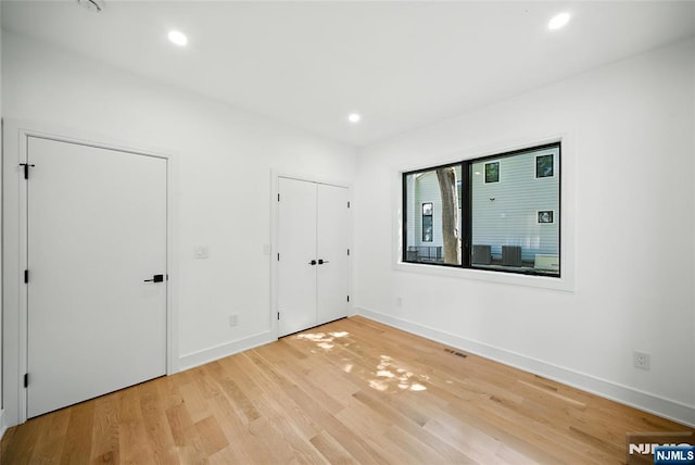 30 Benjamin Rd, Tenafly, NJ 07670 - unfurnished bedroom featuring light wood-type flooring and recessed lighting