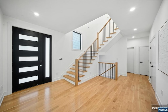 30 Benjamin Rd, Tenafly, NJ 07670 - entrance foyer with wood finished floors, stairs, and recessed lighting