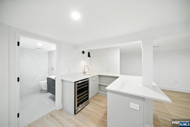 30 Benjamin Rd, Tenafly, NJ 07670 - indoor wet bar with wine cooler and light wood finished floors