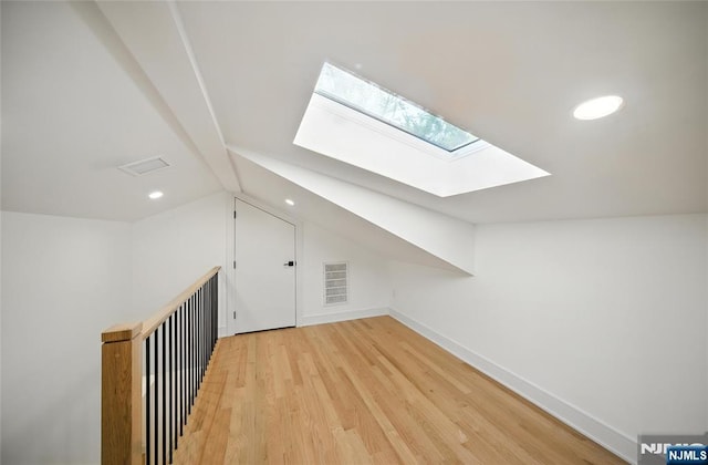 30 Benjamin Rd, Tenafly, NJ 07670 - additional living space featuring a skylight, lofted ceiling, light wood finished floors, and recessed lighting
