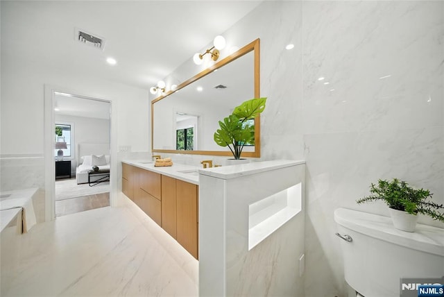 30 Benjamin Rd, Tenafly, NJ 07670 - bathroom featuring vanity, tile walls, ensuite bathroom, and a bath