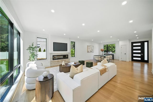 30 Benjamin Rd, Tenafly, NJ 07670 - living room with recessed lighting, a high end fireplace, and light wood-style flooring