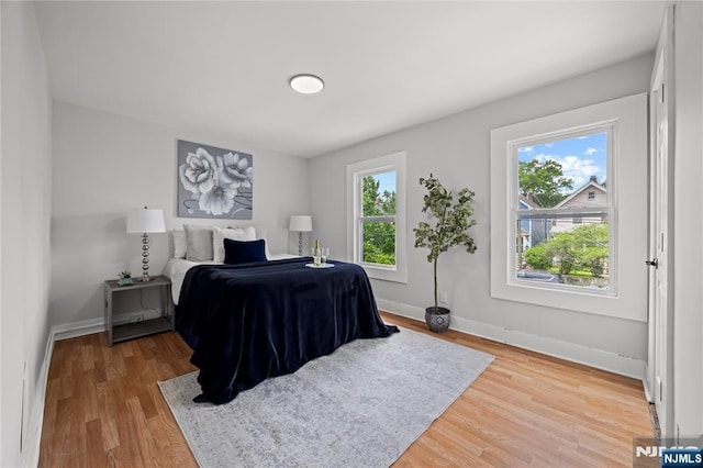 422 Davis Ave, Kearny, NJ 07032 - bedroom with light wood-style floors and baseboards
