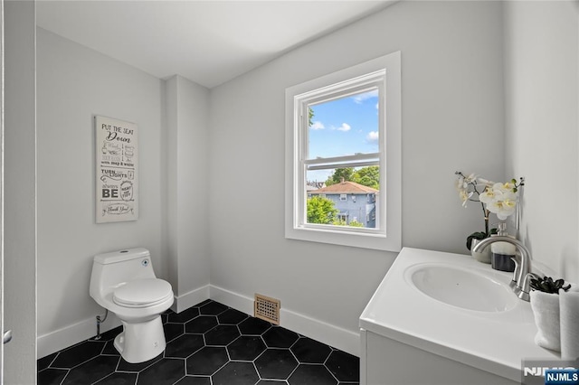 422 Davis Ave, Kearny, NJ 07032 - half bathroom with vanity and tile patterned floors