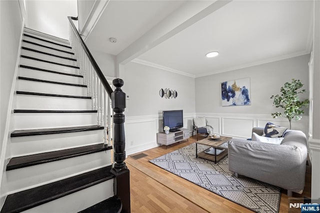 422 Davis Ave, Kearny, NJ 07032 - living room with stairway, crown molding, wood finished floors, wainscoting, and recessed lighting