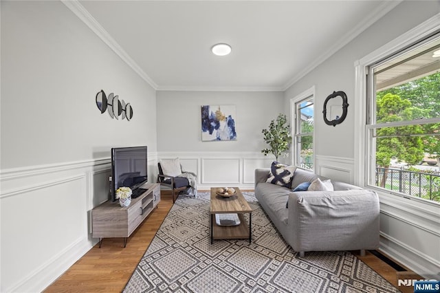 422 Davis Ave, Kearny, NJ 07032 - living area with ornamental molding, light wood-style floors, a wainscoted wall, and a decorative wall