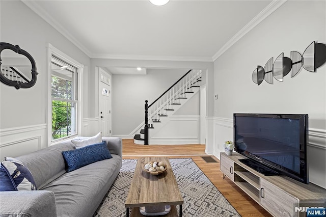 422 Davis Ave, Kearny, NJ 07032 - living room featuring stairs, crown molding, wood finished floors, and a wainscoted wall