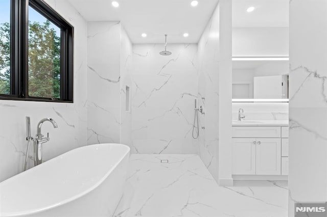 172 Birchwood, Old Tappan, NJ 07675 - bathroom featuring marble tiled flooring, vanity, a freestanding tub, recessed lighting, and a marble finish shower