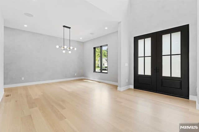 172 Birchwood, Old Tappan, NJ 07675 - entrance foyer with french doors, light wood finished floors, a chandelier, and recessed lighting