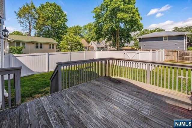 41 S Demarest Ave, Bergenfield, NJ 07621 - wooden terrace featuring a fenced backyard