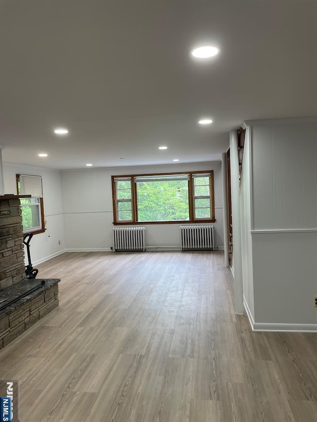 297 Terhune Dr, Wayne, NJ 07470 - unfurnished living room featuring radiator, wood finished floors, and recessed lighting