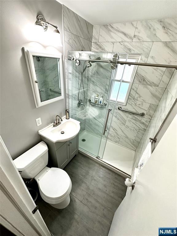 265 Wilson St, Saddle Brook, NJ 07663 - full bathroom featuring a stall shower and vanity