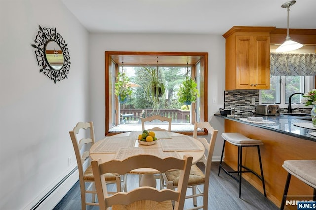552 Godwin Ave, Midland Park, NJ 07432 - dining space with wood finished floors and a baseboard heating unit