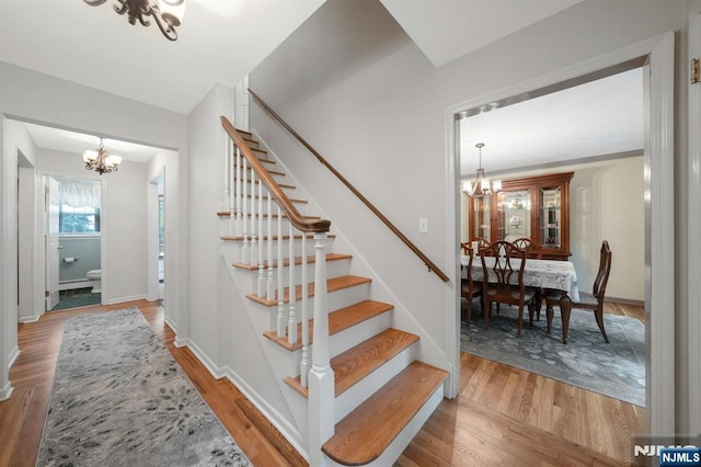 552 Godwin Ave, Midland Park, NJ 07432 - stairs featuring a chandelier and wood finished floors