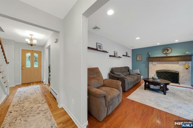 552 Godwin Ave, Midland Park, NJ 07432 - entrance foyer featuring stairs, a baseboard heating unit, a chandelier, light wood-style flooring, and recessed lighting