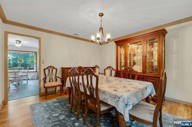 552 Godwin Ave, Midland Park, NJ 07432 - dining room featuring a chandelier, wood finished floors, and crown molding
