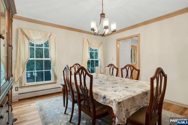 552 Godwin Ave, Midland Park, NJ 07432 - dining space featuring a baseboard heating unit, a chandelier, light wood-style floors, and crown molding