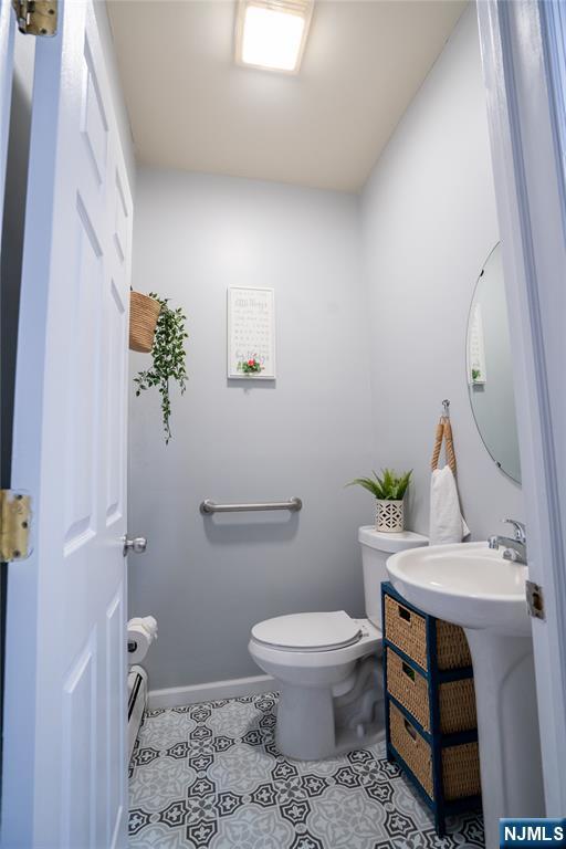 95 Mount Prospect Ave, Newark, NJ 07104 - bathroom with toilet and tile patterned floors