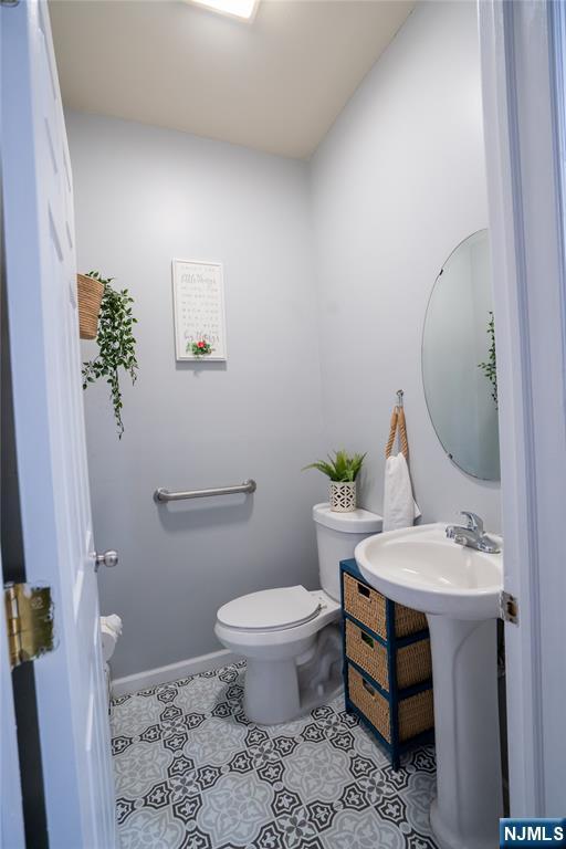 95 Mount Prospect Ave, Newark, NJ 07104 - bathroom featuring toilet and tile patterned floors