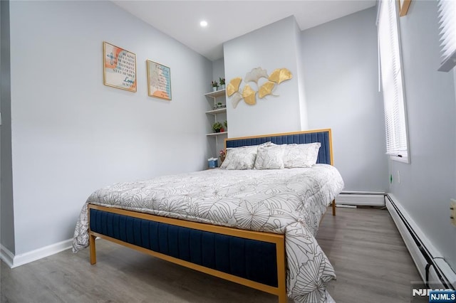 95 Mount Prospect Ave, Newark, NJ 07104 - bedroom featuring baseboard heating, wood finished floors, and recessed lighting