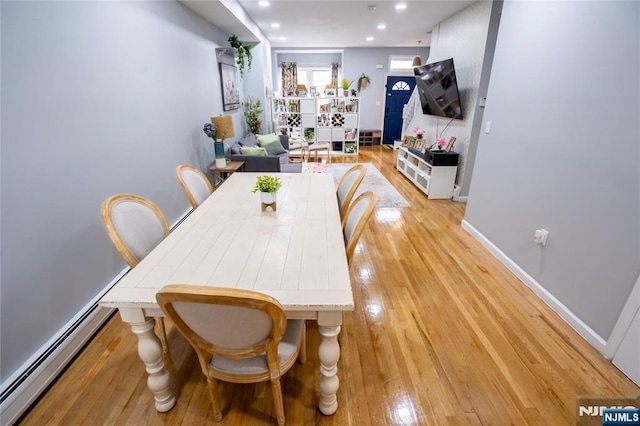 95 Mount Prospect Ave, Newark, NJ 07104 - dining space with a baseboard heating unit, light wood-type flooring, and recessed lighting