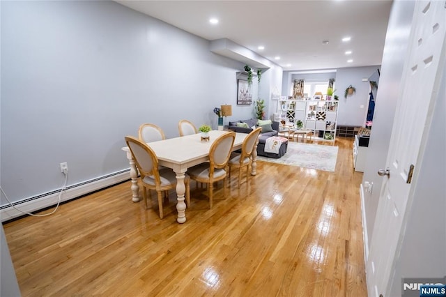 95 Mount Prospect Ave, Newark, NJ 07104 - dining space with light wood-style floors, a baseboard radiator, and recessed lighting
