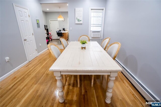 95 Mount Prospect Ave, Newark, NJ 07104 - dining area featuring cooling unit, light wood finished floors, and baseboard heating