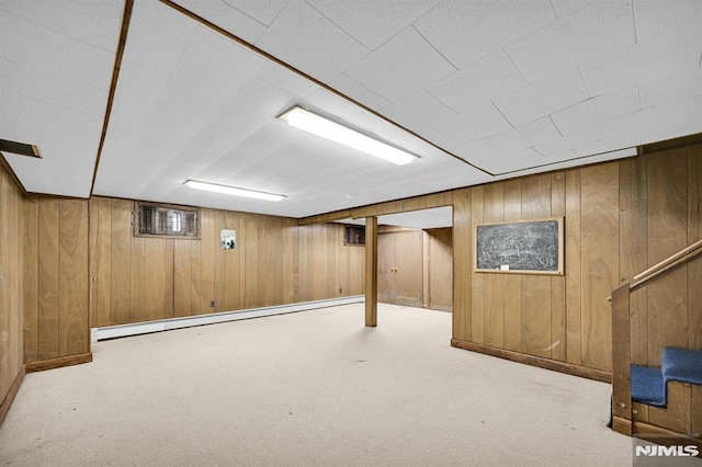 0-04 Pine Ave, Fair Lawn, NJ 07410 - finished basement featuring a baseboard heating unit, wooden walls, and carpet