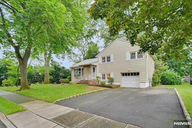 0-04 Pine Ave, Fair Lawn, NJ 07410 - split level home featuring driveway, a front yard, and an attached garage