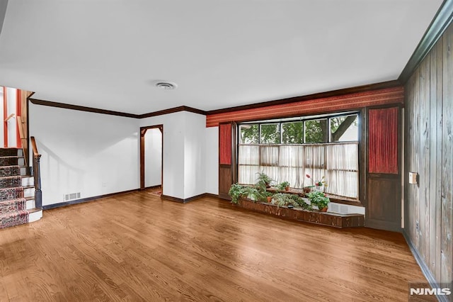 0-04 Pine Ave, Fair Lawn, NJ 07410 - unfurnished living room with ornamental molding, wood finished floors, and stairs
