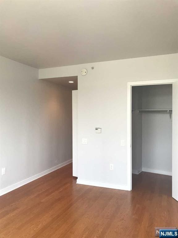 1611 Hudson Park Unit 1611, Edgewater, NJ 07020 - unfurnished bedroom with wood finished floors, a spacious closet, and a closet