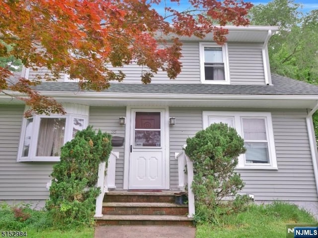 35 3rd Ave, Little Falls, NJ 07424 - view of front of house with a shingled roof