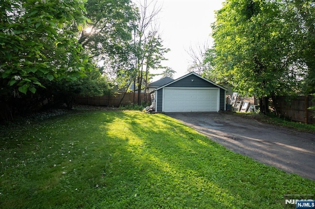 35 3rd Ave, Little Falls, NJ 07424 - view of yard featuring an outdoor structure and a garage