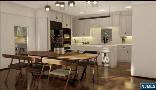 470 Myrtle Ave, Englewood, NJ 07631 - dining area featuring wood finished floors