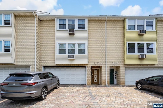 188 Park St, East Orange, NJ 07017 - multi unit property featuring a garage, driveway, and brick siding