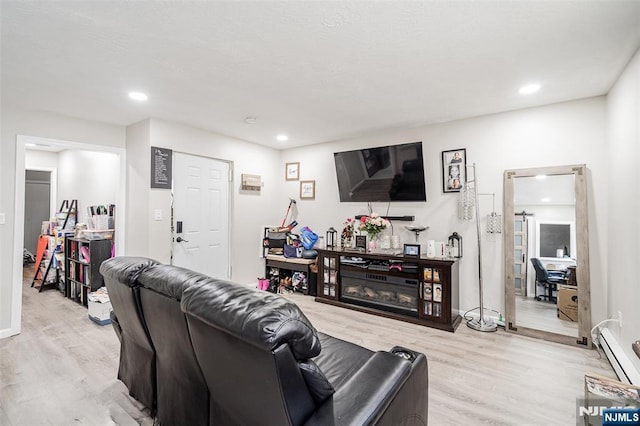 188 Park St, East Orange, NJ 07017 - living area featuring light wood-style flooring, baseboard heating, and recessed lighting