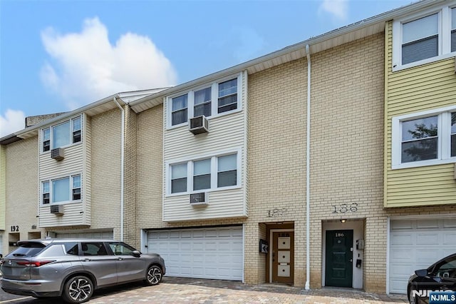 188 Park St, East Orange, NJ 07017 - multi unit property with a garage, brick siding, and driveway