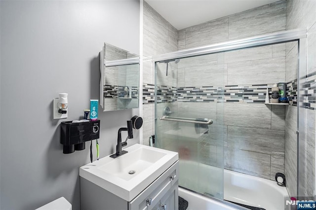 188 Park St, East Orange, NJ 07017 - full bathroom featuring shower / bath combination with glass door and vanity