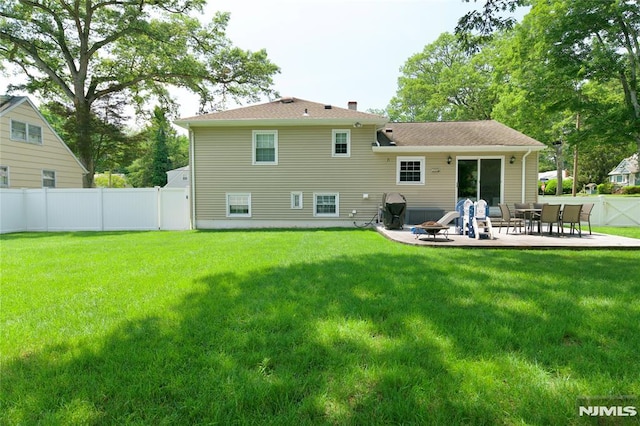 218 Evergreen St, Hillsdale, NJ 07642 - rear view of house featuring a patio area, a fire pit, and a chimney