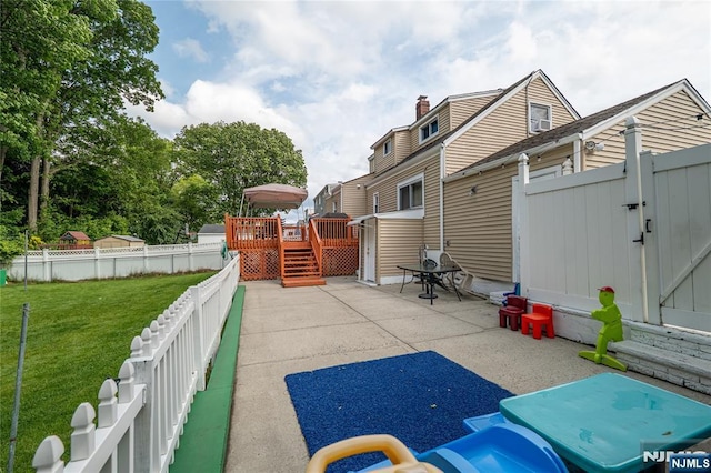 72 N Dr, Rochelle Park, NJ 07662 - fenced backyard featuring a wooden deck, a gate, and a patio area